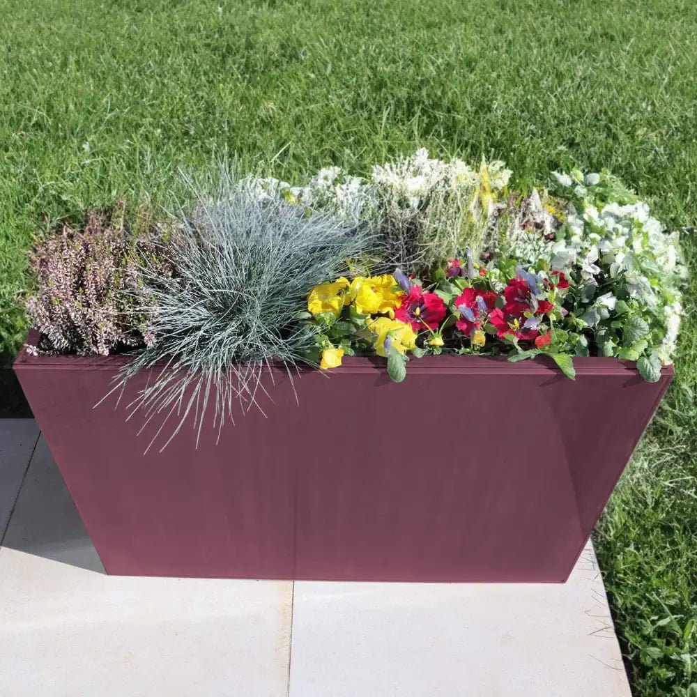Luxurious rose gold metal trough planter, ideal for showcasing a single statement plant or herb.
