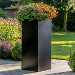 Extra large planters brimming with lush foliage.