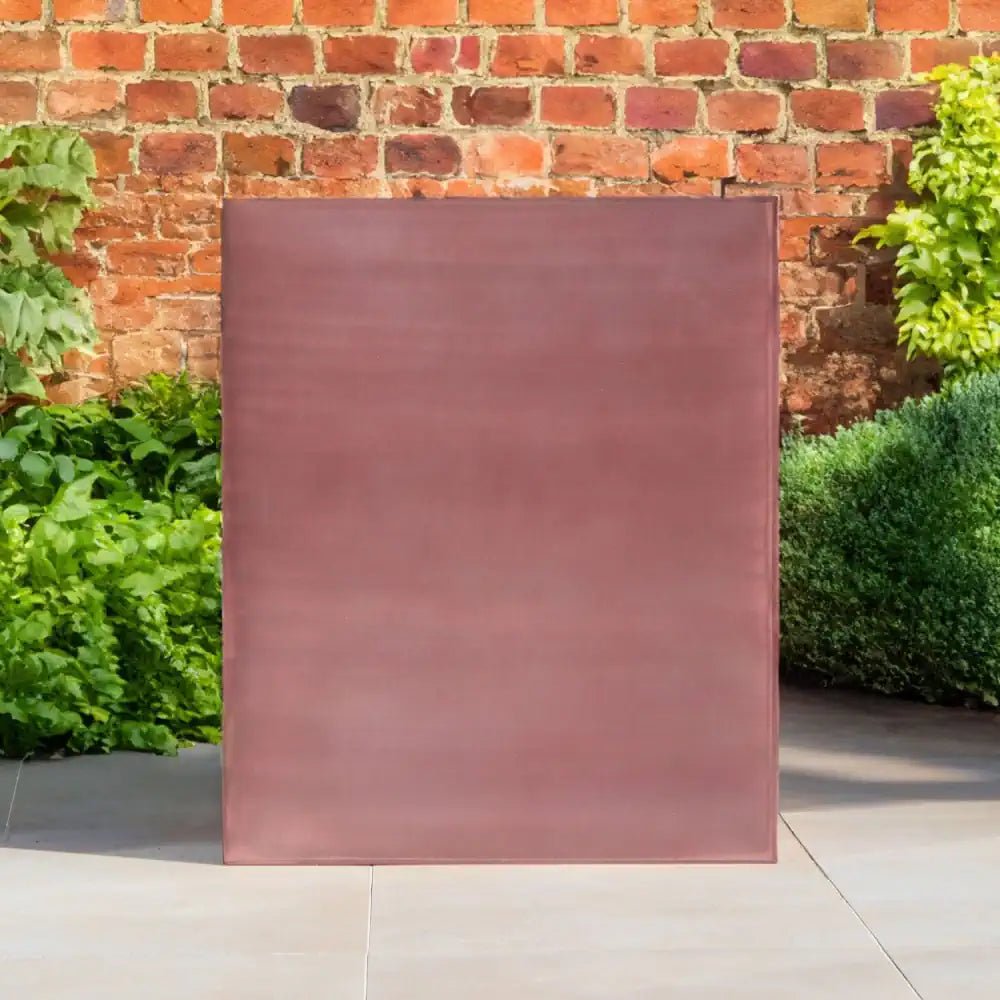 Sleek rose gold metal planter in a tall, rectangular shape, ideal for modern indoor plants.