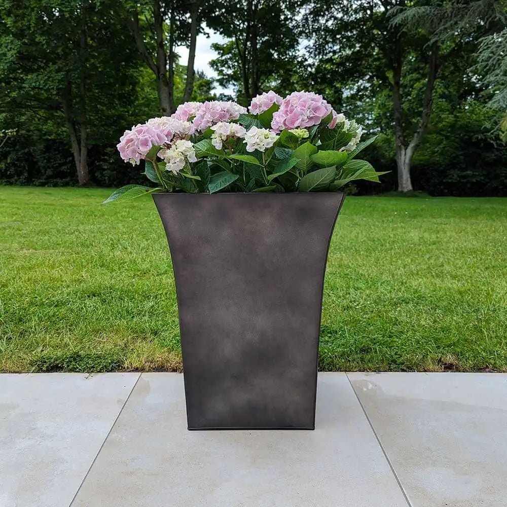 Tapered planters set up in a modern living room