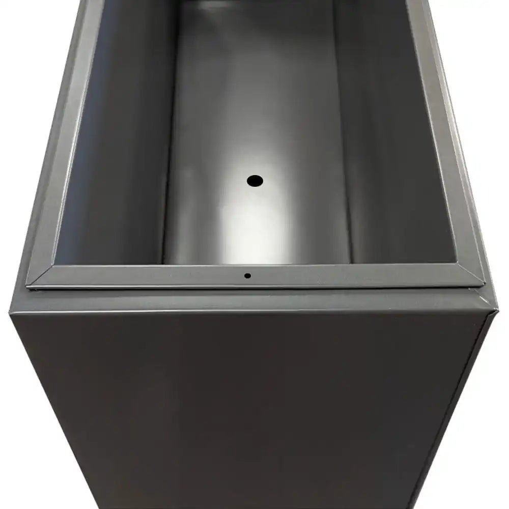 Large grey planters serving as stylish accents in a modern landscape.