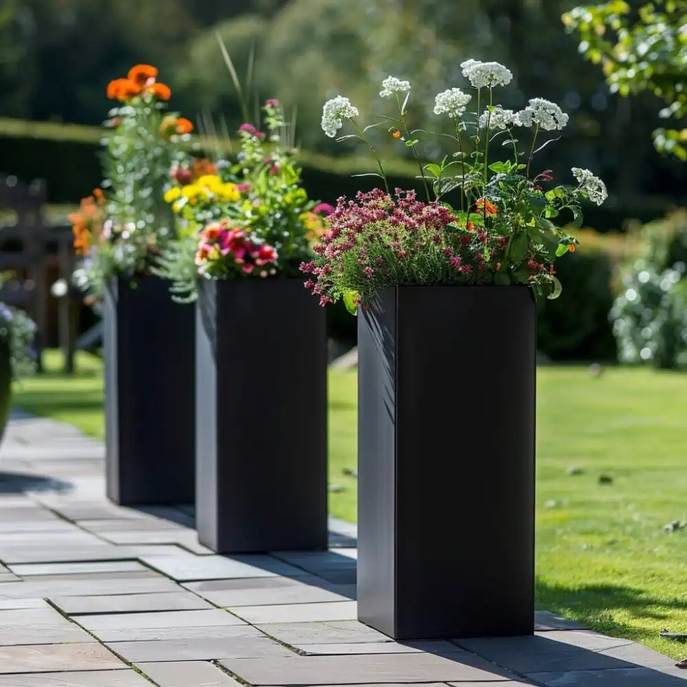 Overflowing large garden planters bursting with colorful blooms.