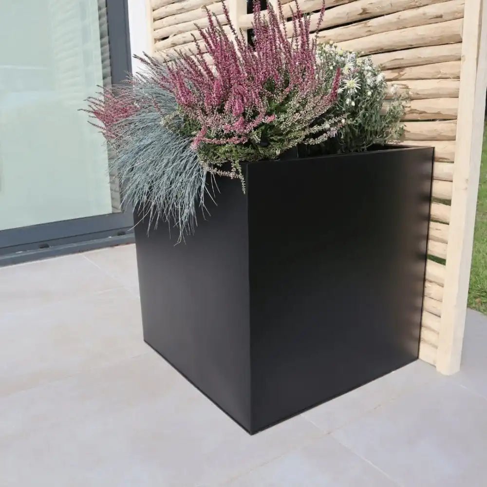 Square planter with leakage plug for conservatories and greenhouses