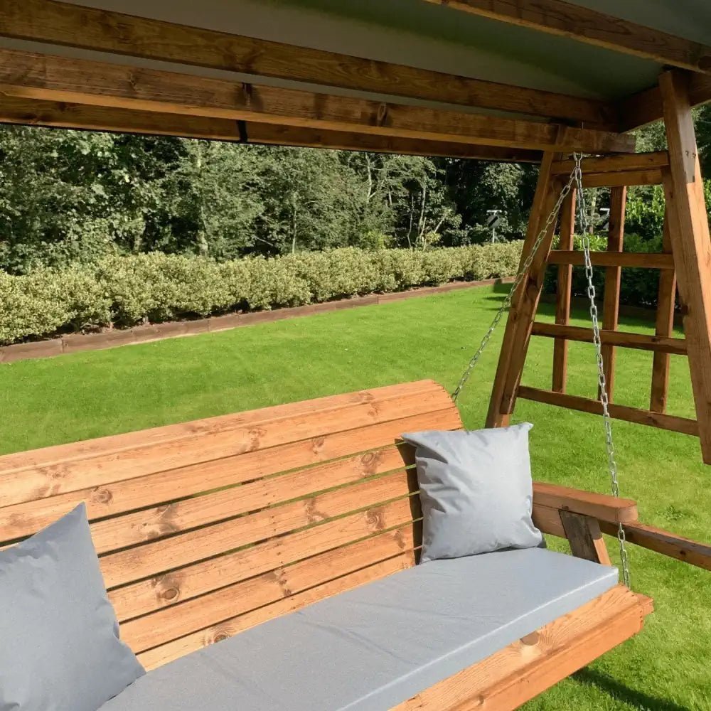 Escape the hustle and bustle on this serene Outdoor Swing Seat, nestled amidst greenery and sunshine.
