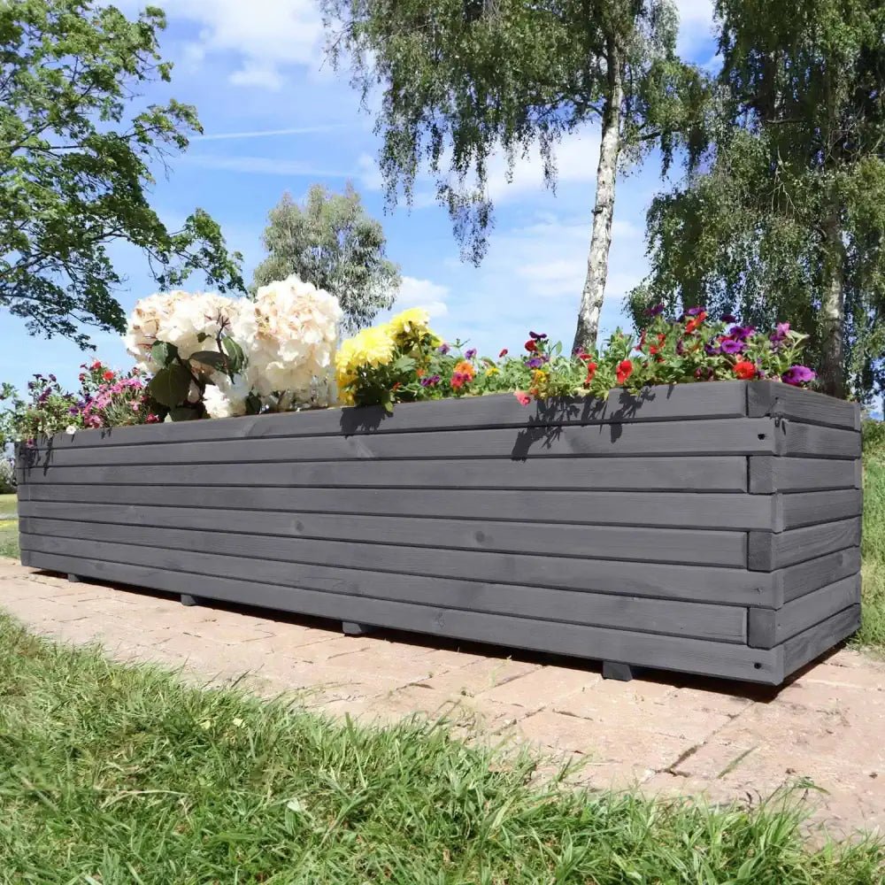 Huge wooden trough planters ideal for growing large ornamental trees or establishing a vegetable garden.
