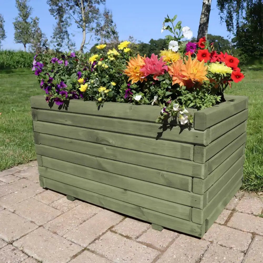 Trough planters overflowing with summer blooms add a vibrant touch to your patio.