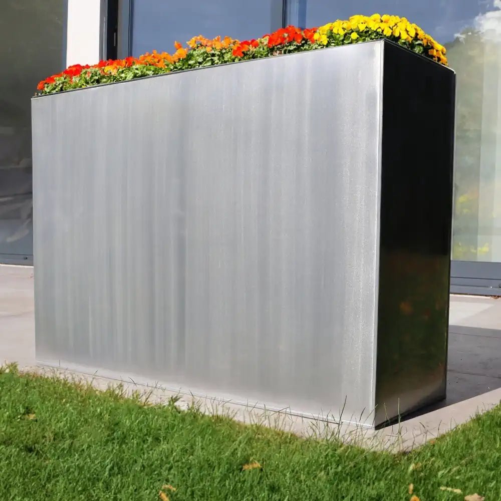 Shiny silver planters gleaming in the sun.
