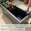 Add our liner to extend your planter warranty by an additional year - silver black textured zinc trough planter with fabric liner fitted